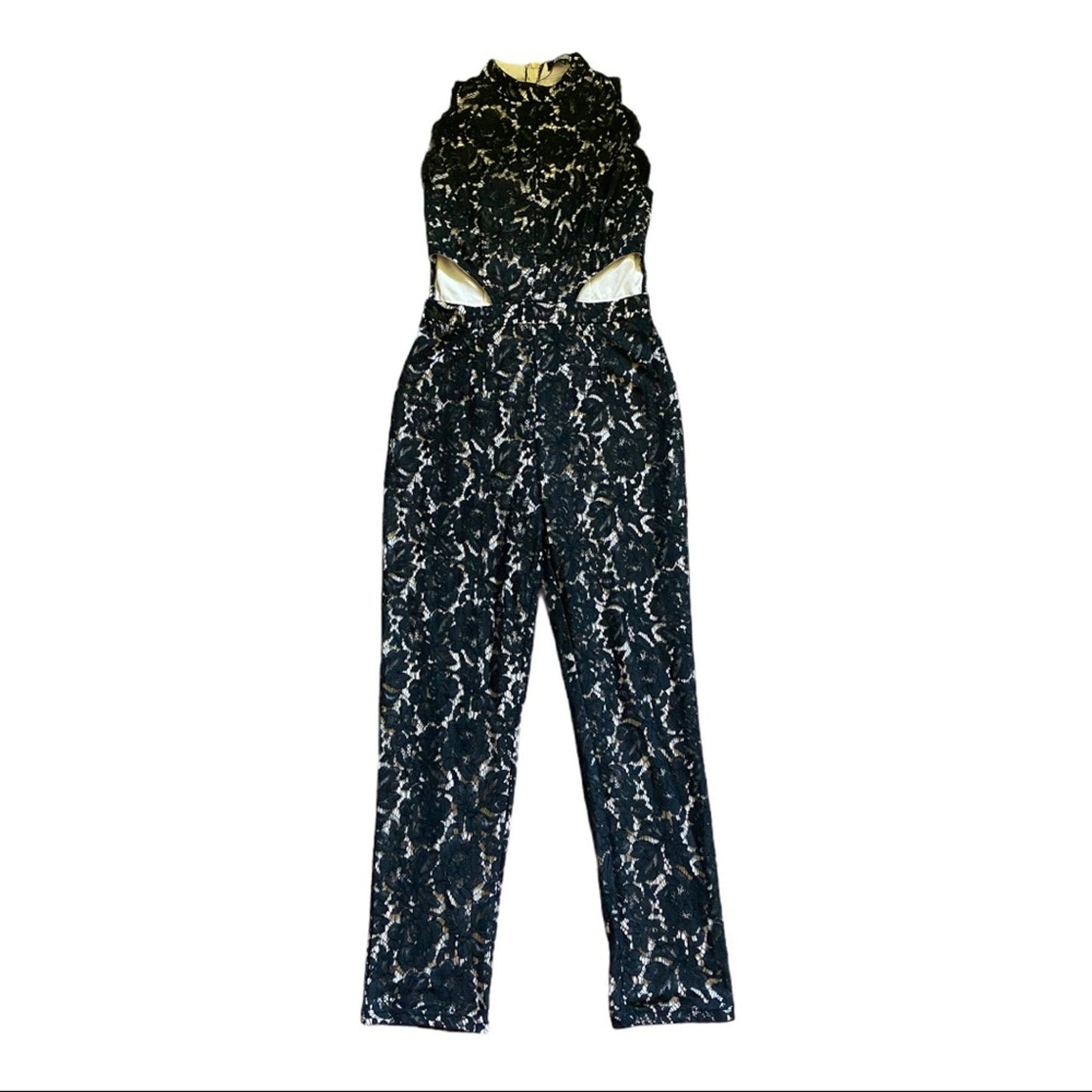Black and white patterned jumpsuit against a white background