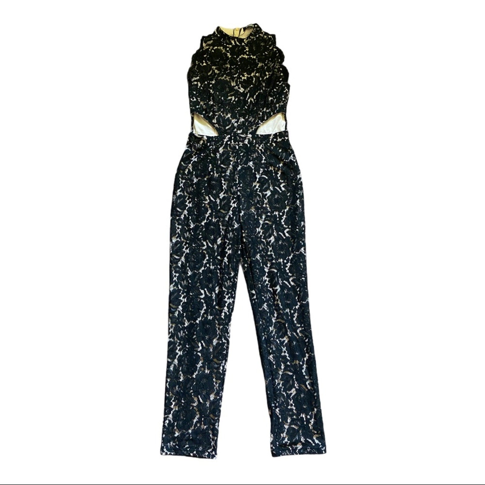 Black and white patterned jumpsuit against a white background