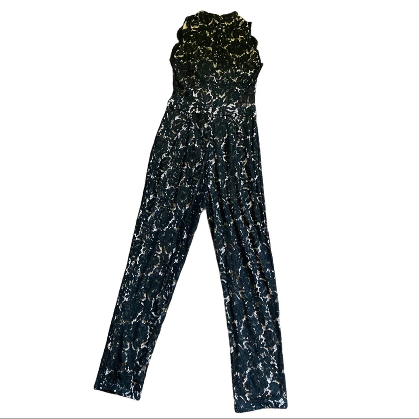 Back of Black and white patterned jumpsuit on a white background