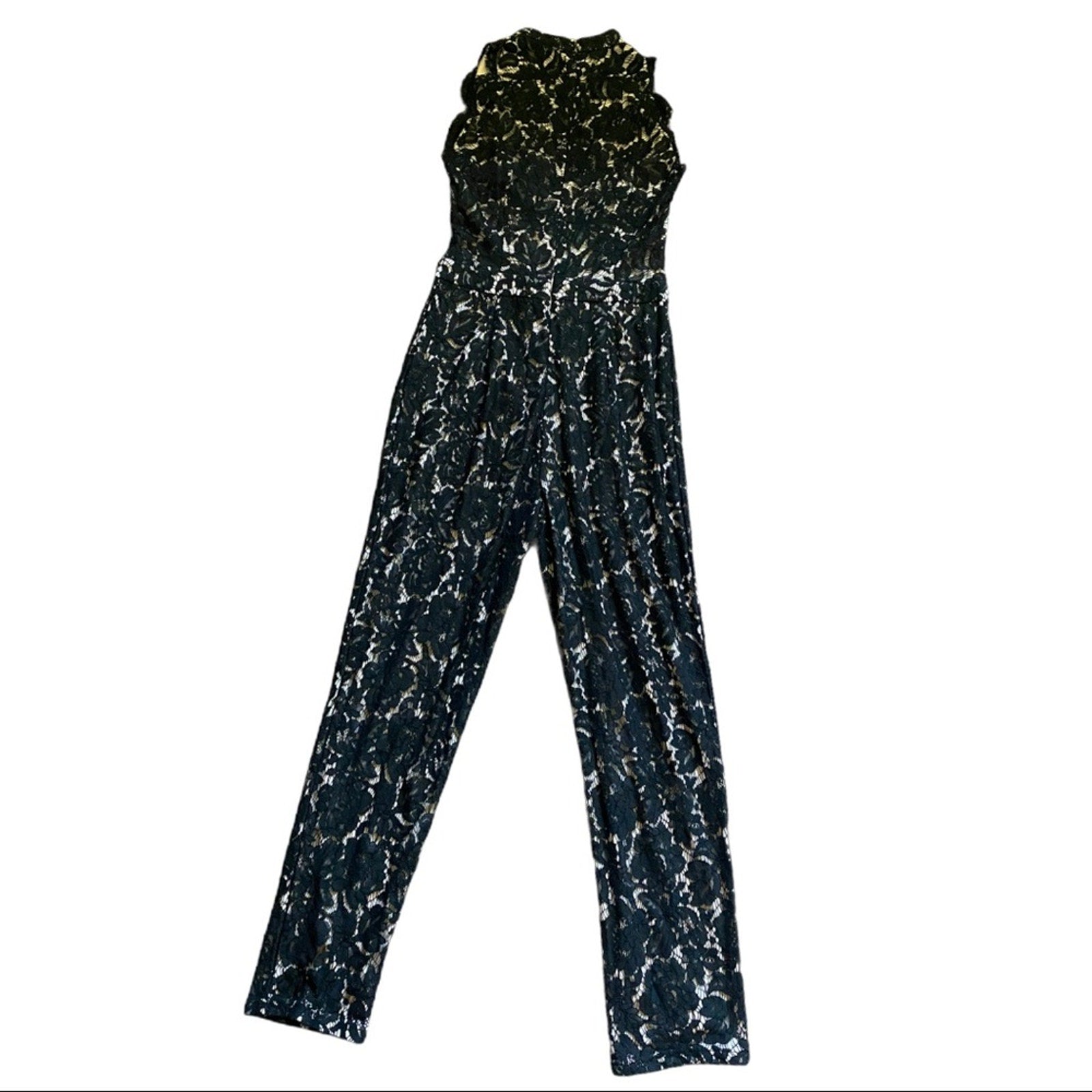 Back of Black and white patterned jumpsuit on a white background