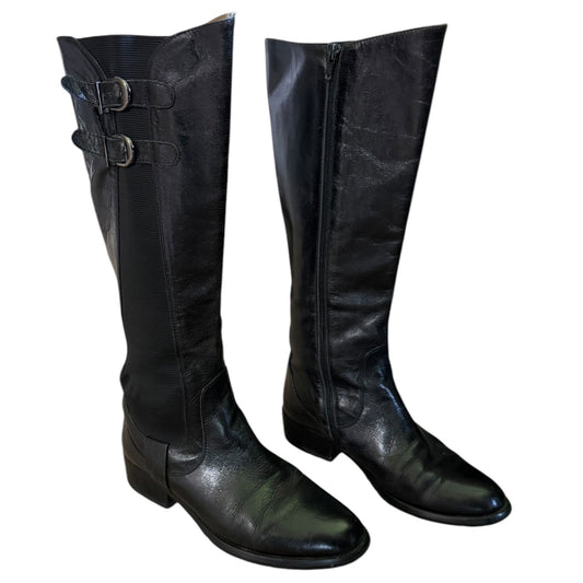 Front side of Pair of black leather knee-high boots on a white background
