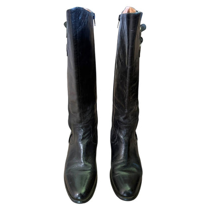 Front view of a Pair of black knee-high boots on a white background