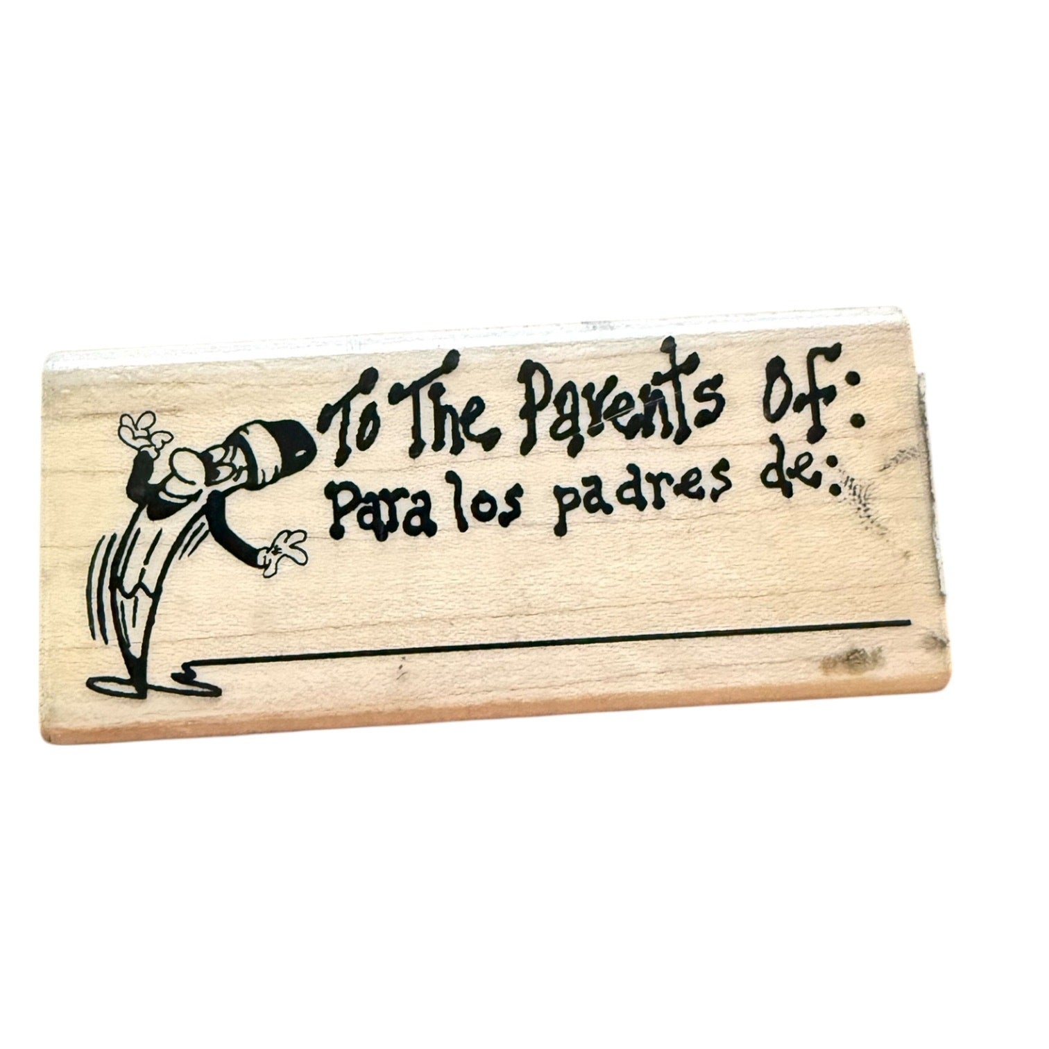 Wooden stamp with text 'To The Parents Of' and a cartoon character on a white background