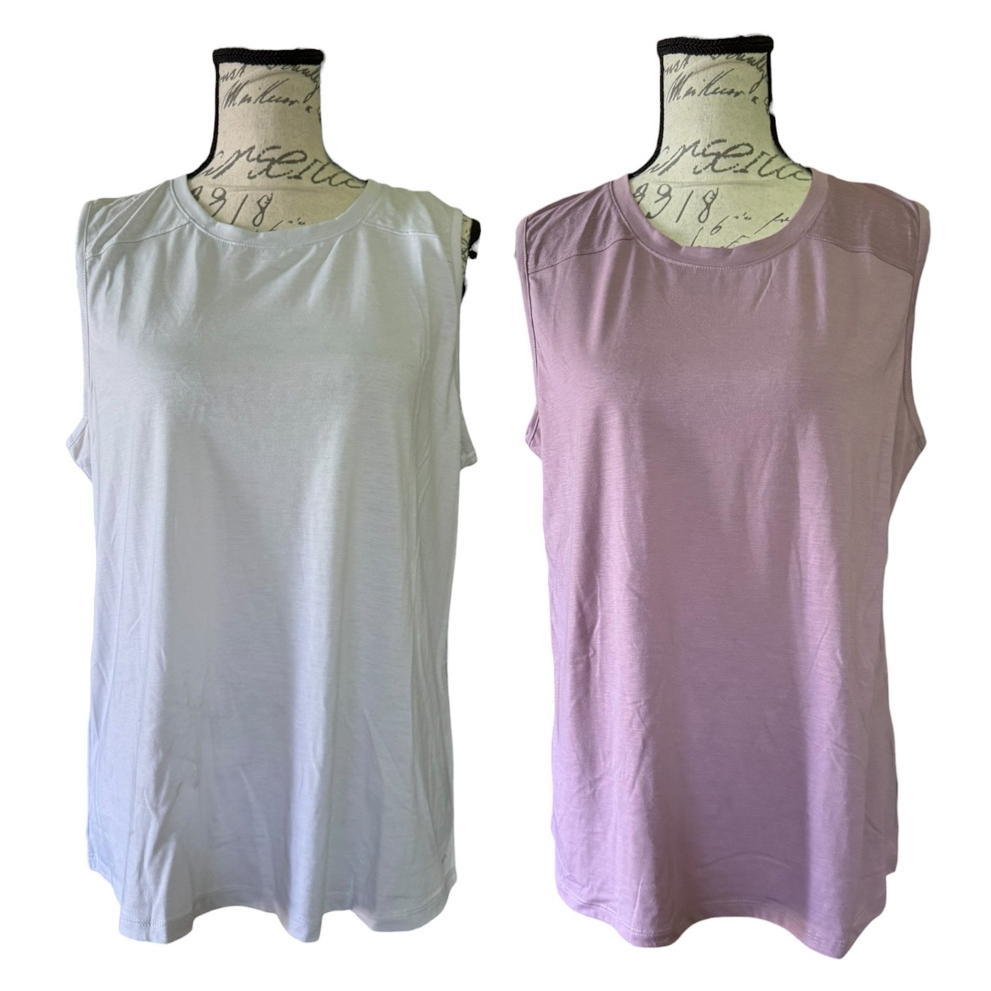 Two sleeveless tank tops displayed on dress forms against a white background. The left top is a very  gray, and the right top is a purple