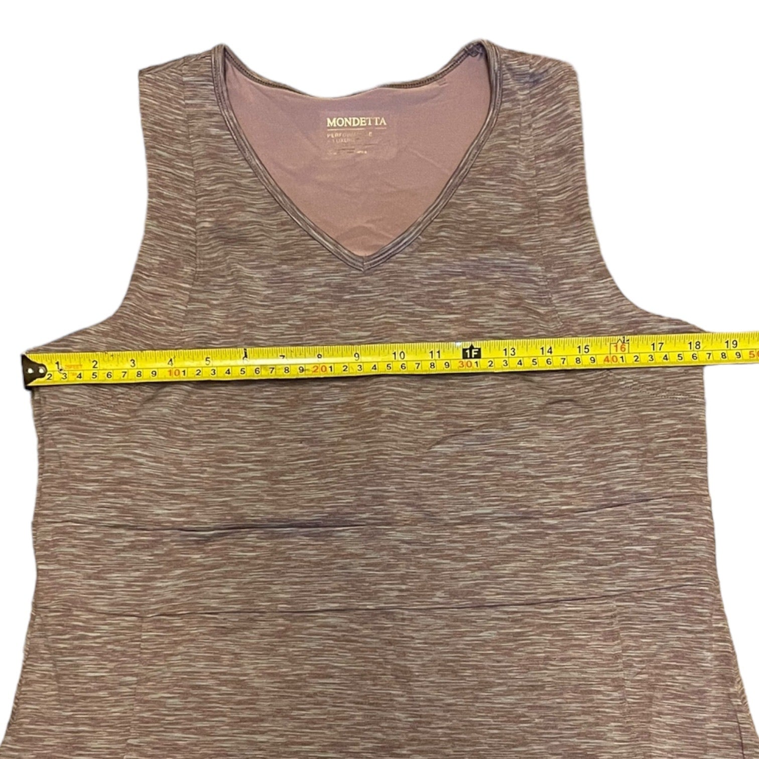PUrple dress with a measuring tape on a white background