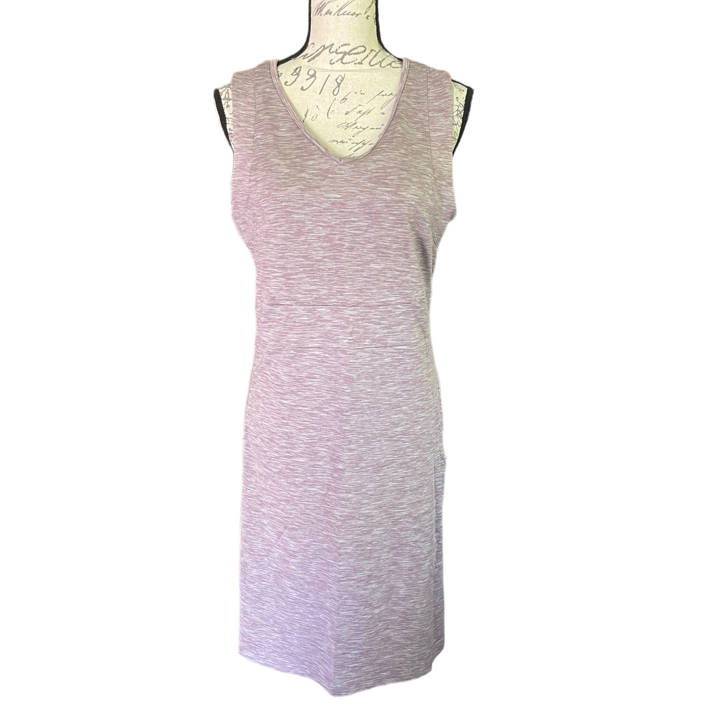 Purple sleeveless dress on a mannequin against a white background