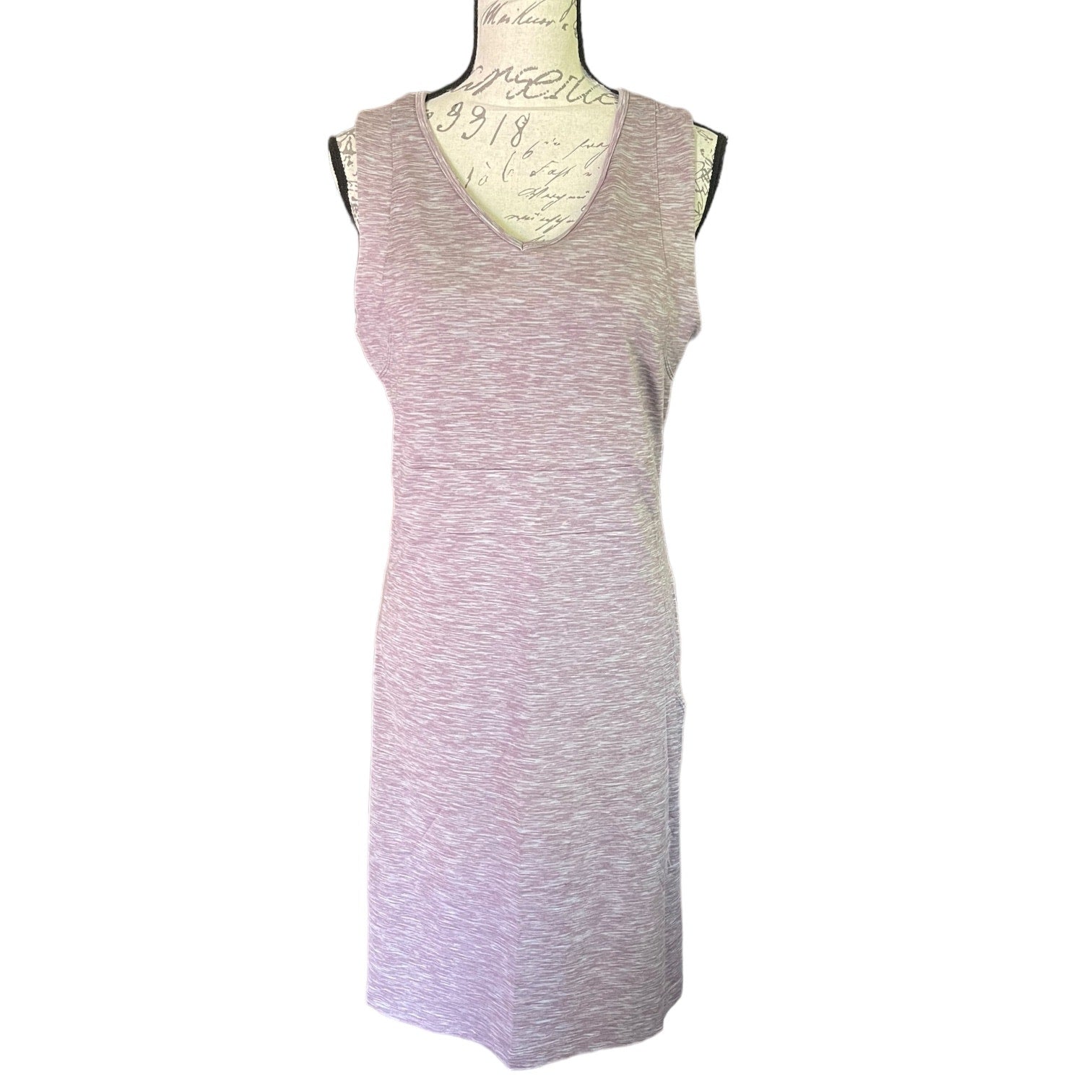 Purple sleeveless dress on a mannequin against a white background