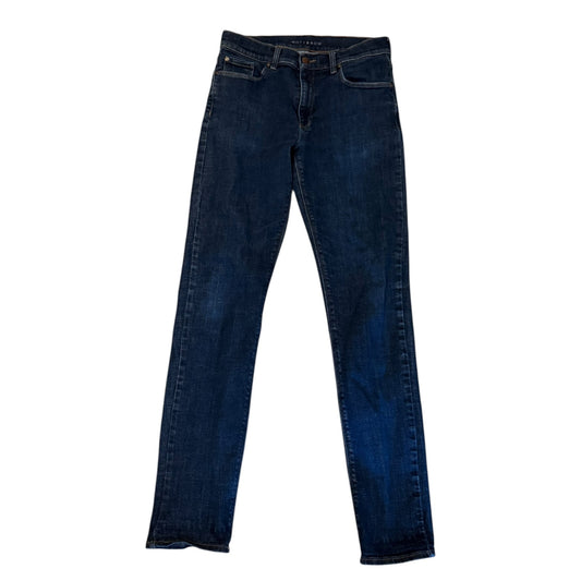 A pair of dark blue denim jeans , shown flat against a plain white background.