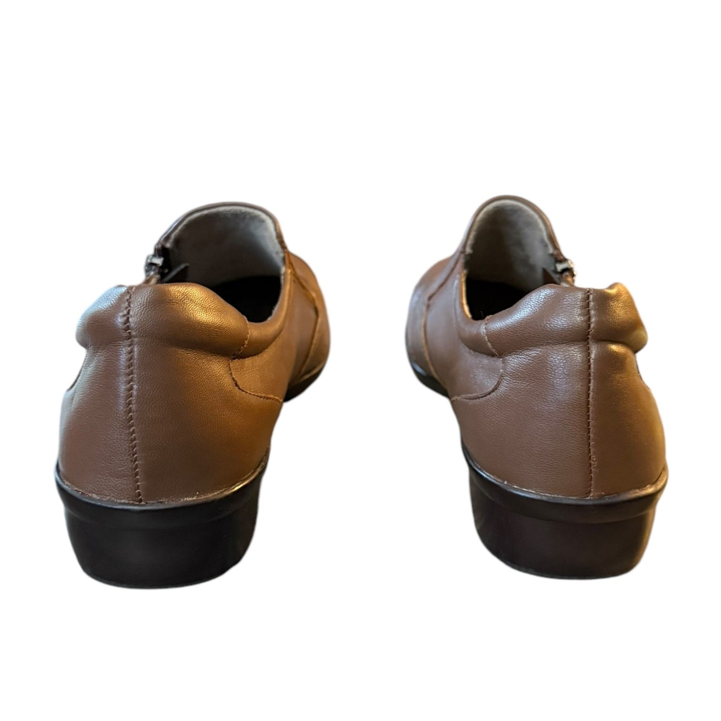 Pair of brown leather shoes  back on a white background