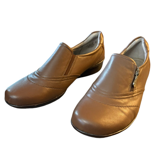 Front side Pair of brown leather shoes on a white background