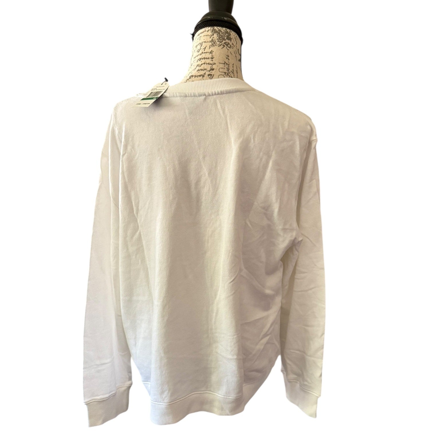 Back of White long-sleeve sweater on a mannequin with a white background
