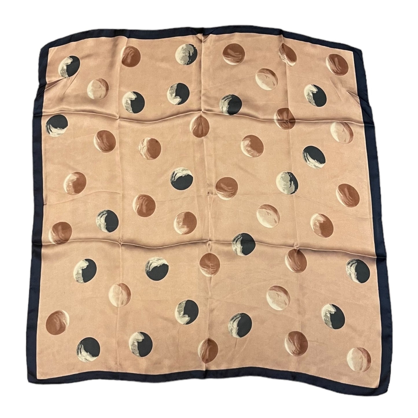 A square scarf laid flat on a white background, featuring a pink base with a pattern of large polka dots, finished with a solid blue border.