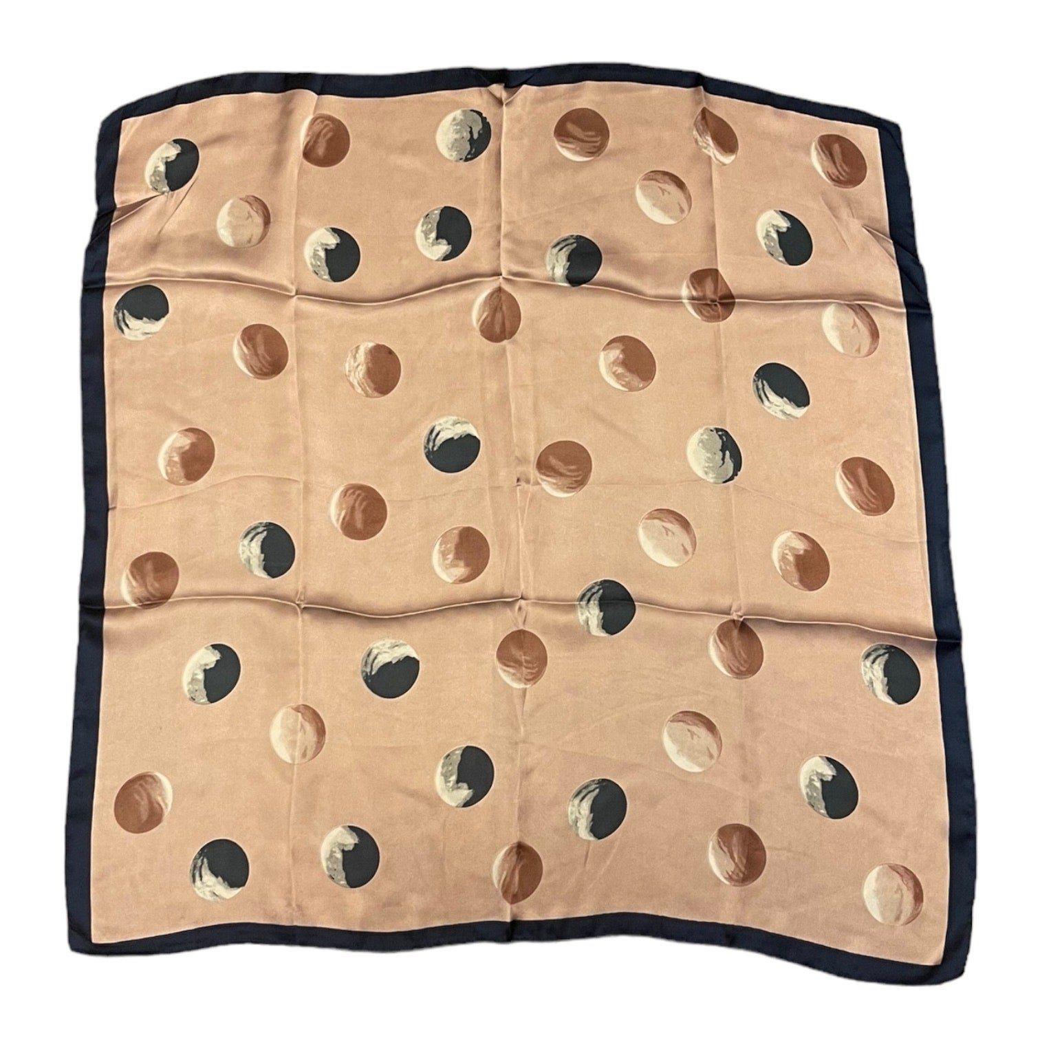 A square scarf laid flat on a white background, featuring a pink base with a pattern of large polka dots, finished with a solid blue border.