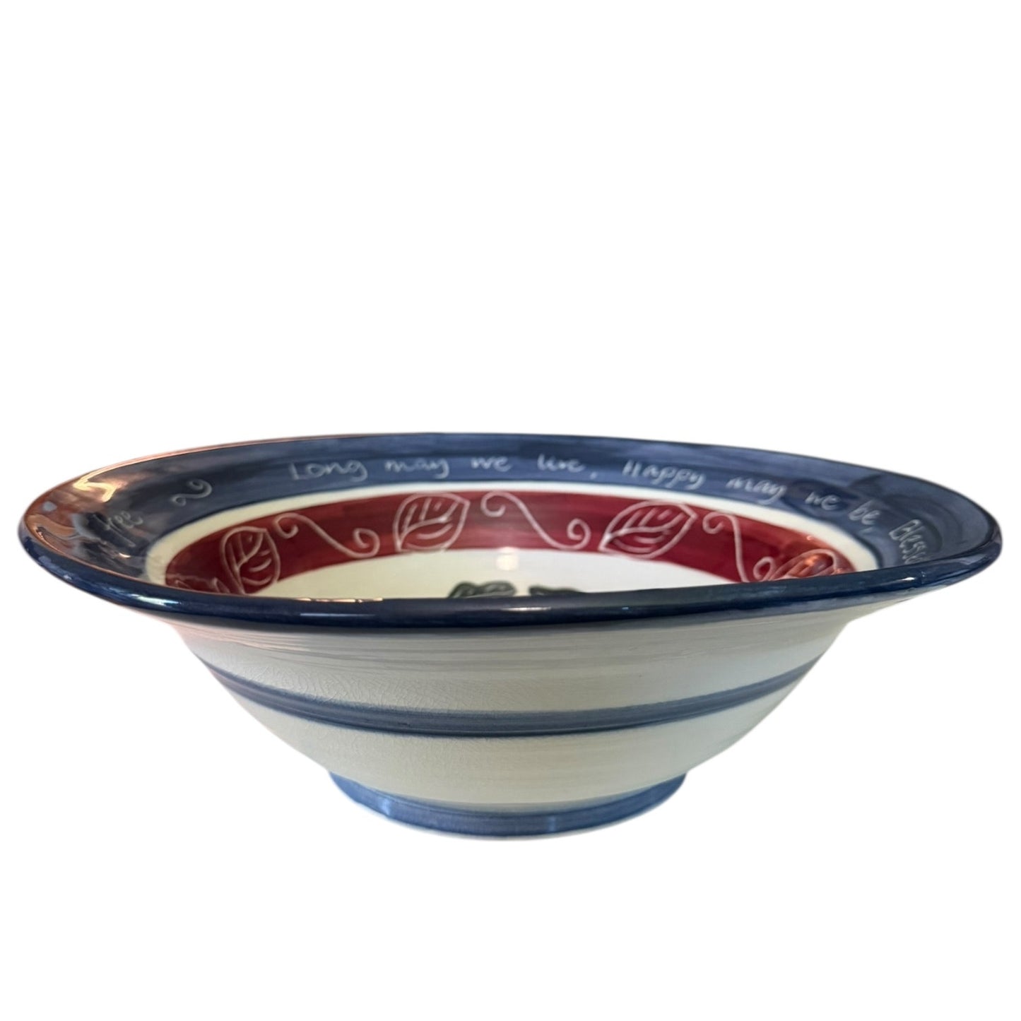 Side of Ceramic bowl with blue, red, and white design on a white background