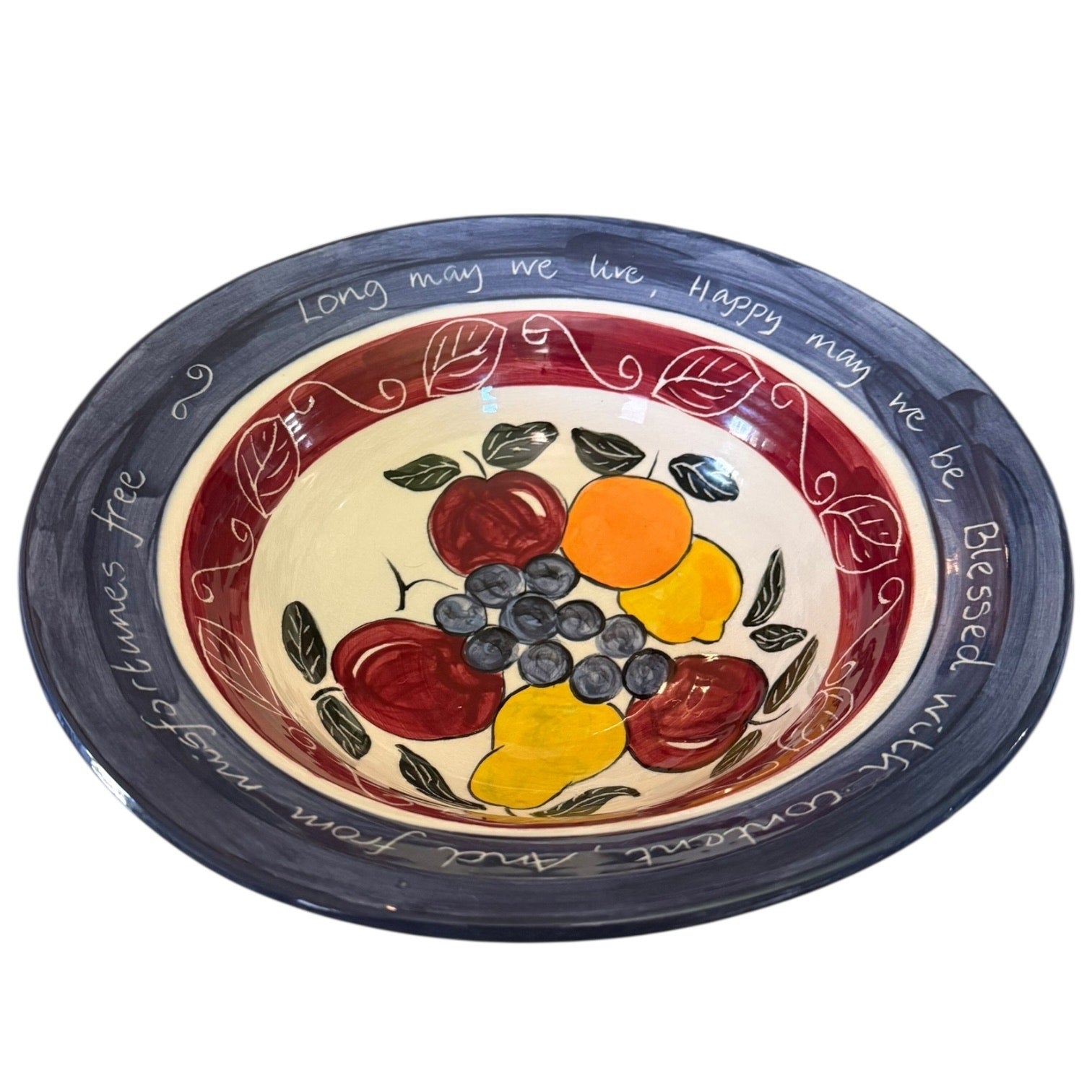 Decorative ceramic plate with fruit design and text on a white background