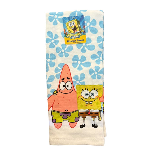 A folded white kitchen towel featuring a blue floral pattern and cartoon characters SpongeBob SquarePants and Patrick Star, with a paper tag attached at the top.