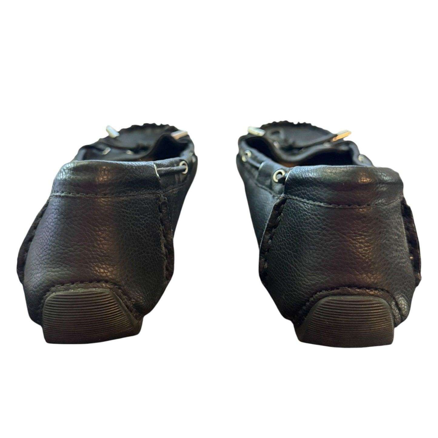 Back of a Pair of black leather shoes on a white background