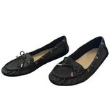 Front side of a Pair of black loafers on a white background