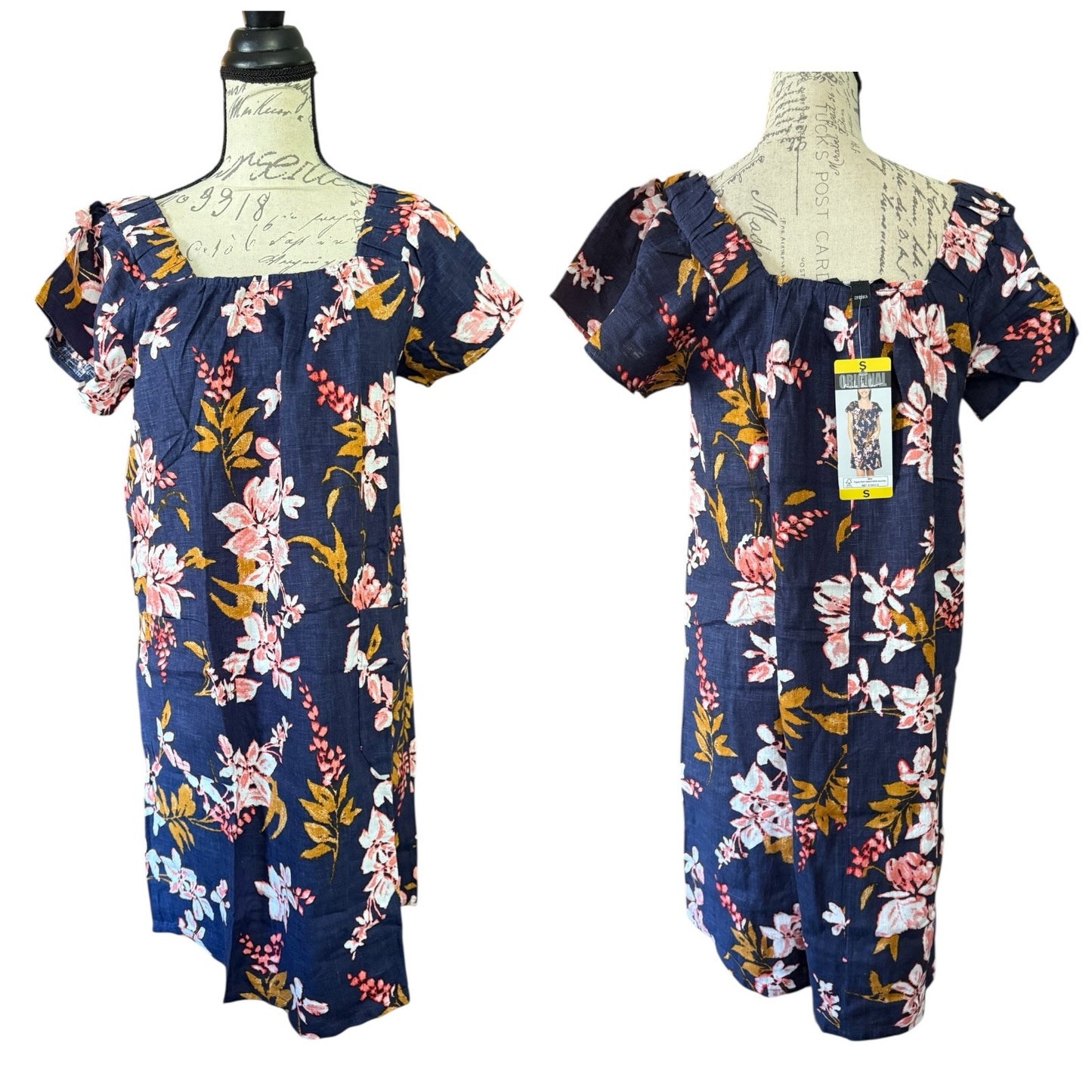 Navy floral dress on a mannequin with a white background