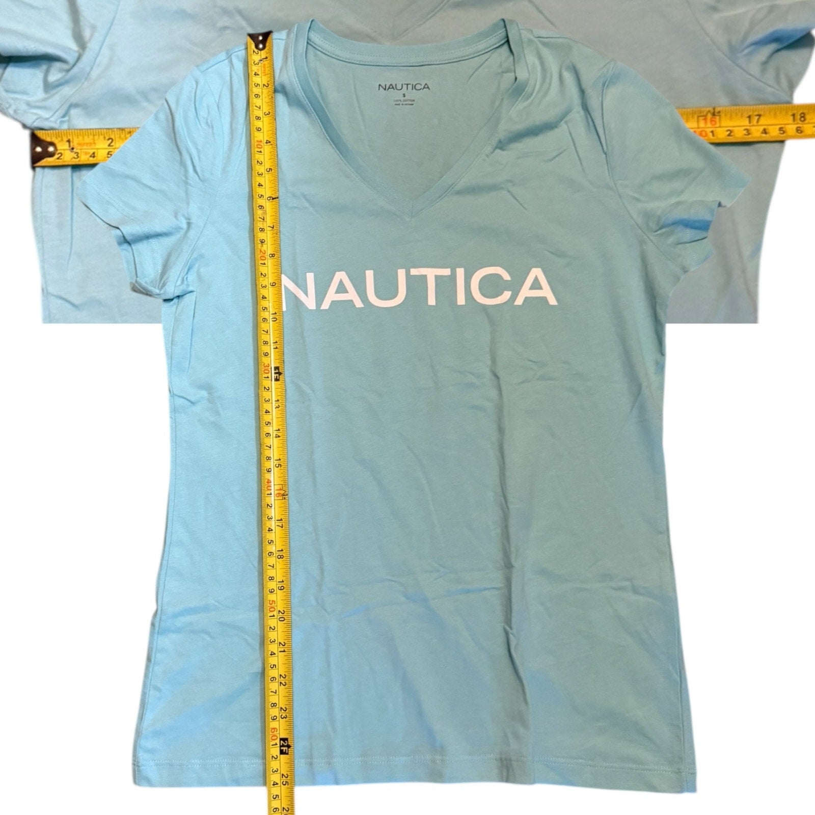 Light blue Nautica t-shirt with a measuring tape displayed on a white background