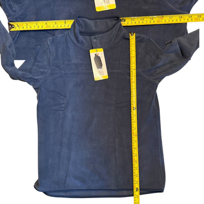 Blue fleece shirt with a tag and measuring tape on a white background