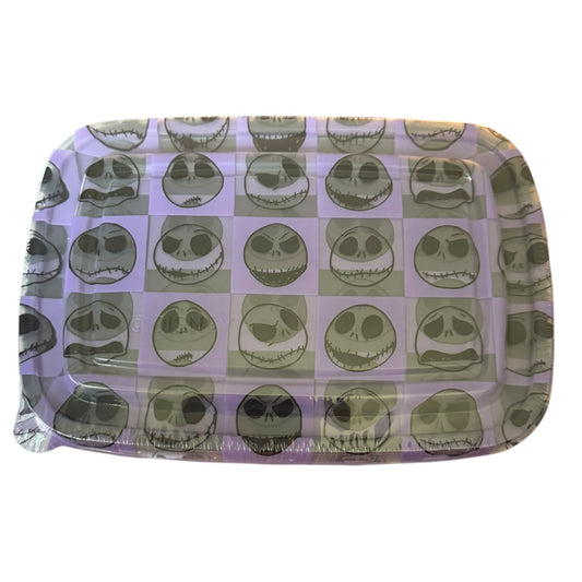 A rectangular plastic tray with rounded corners, featuring a repeating pattern of Jack Skellington's face in a checkerboard design. 