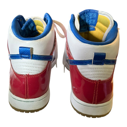 Back of a Pair of red, white, and blue sneakers on a white background