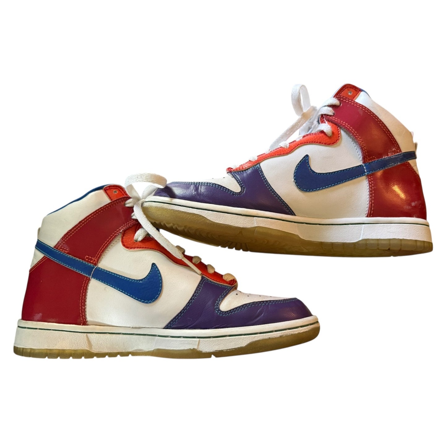 Side view of Colorful sneakers with a prominent blue logo on a white background