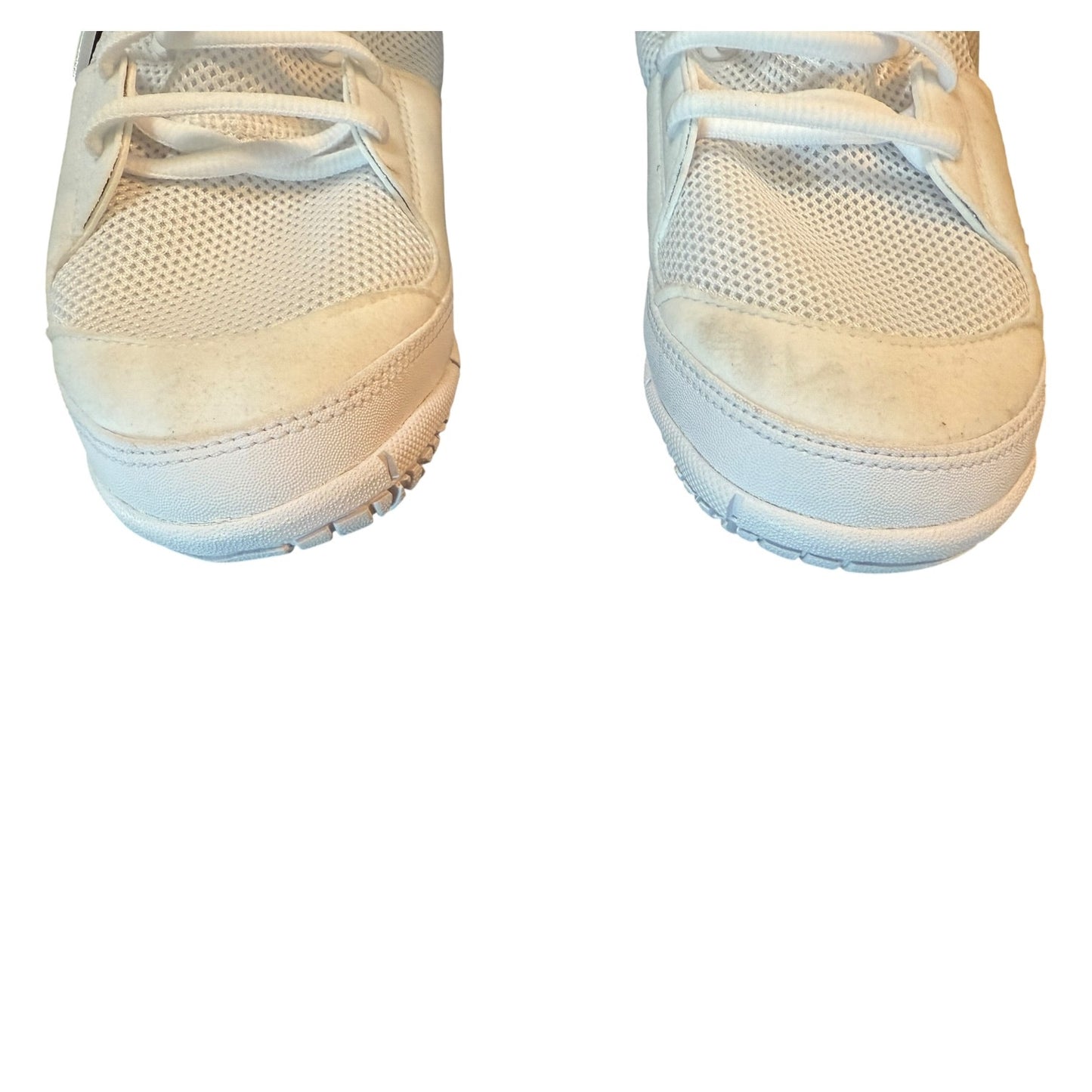 Pair of white sneakers with issues on a white background