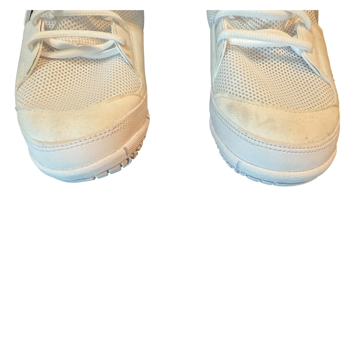 Pair of white sneakers with issues on a white background