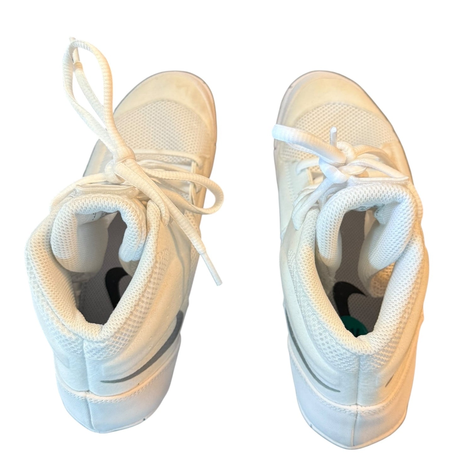 Pair of white sneakers from the top on a white background