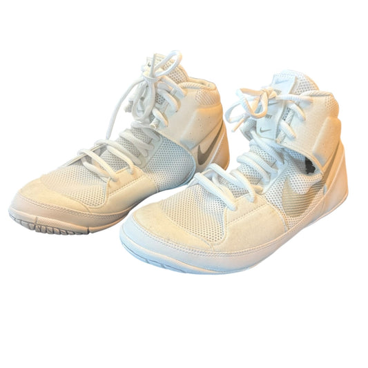 Pair of white high-top sneakers on a white background