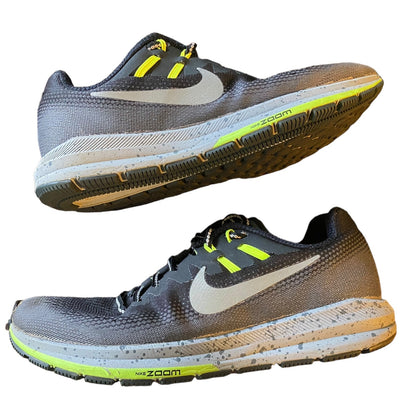 Side of running shoes with Nike logo and 'zoom' text on a white background