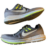 Side of running shoes with Nike logo and 'zoom' text on a white background