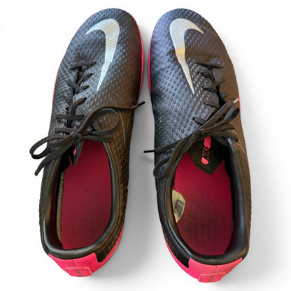 Pair of black and pink sports shoes with a visible brand logo on a white background