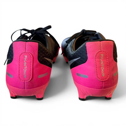 Pink soccer cleats with black accents on a white background