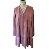 Pink dress on a mannequin against a white background