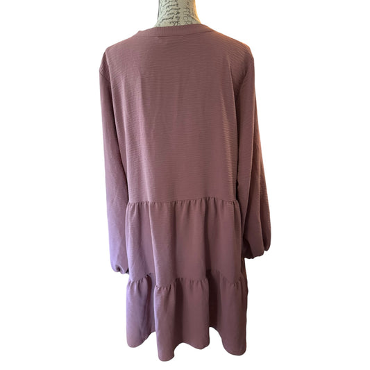 Back of pink dress on a mannequin with a white background