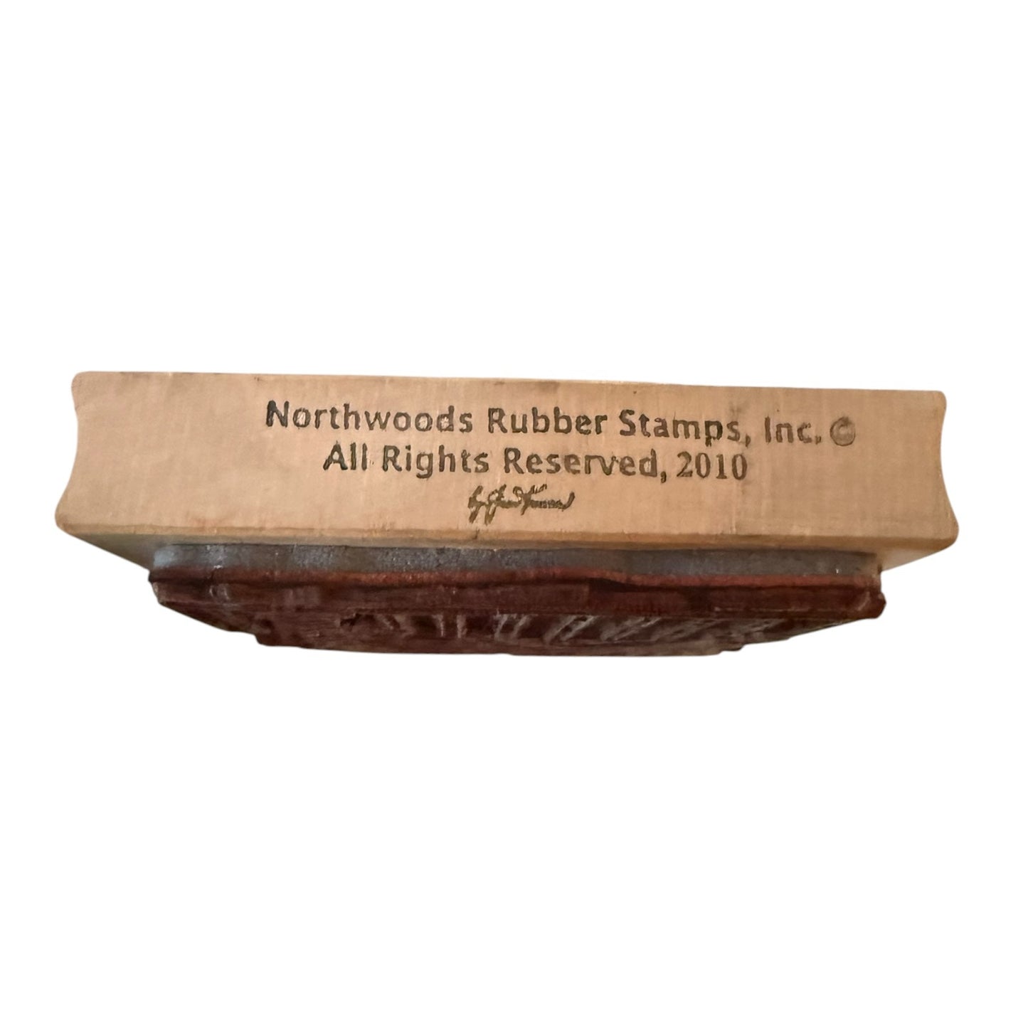 A Northwoods Rubber Stamps, Inc. wooden printing block with a dark brown rubber stamp face, shown on a plain white background.