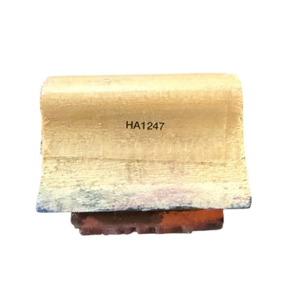 Wooden stamp with 'HA1247' engraving on a white background