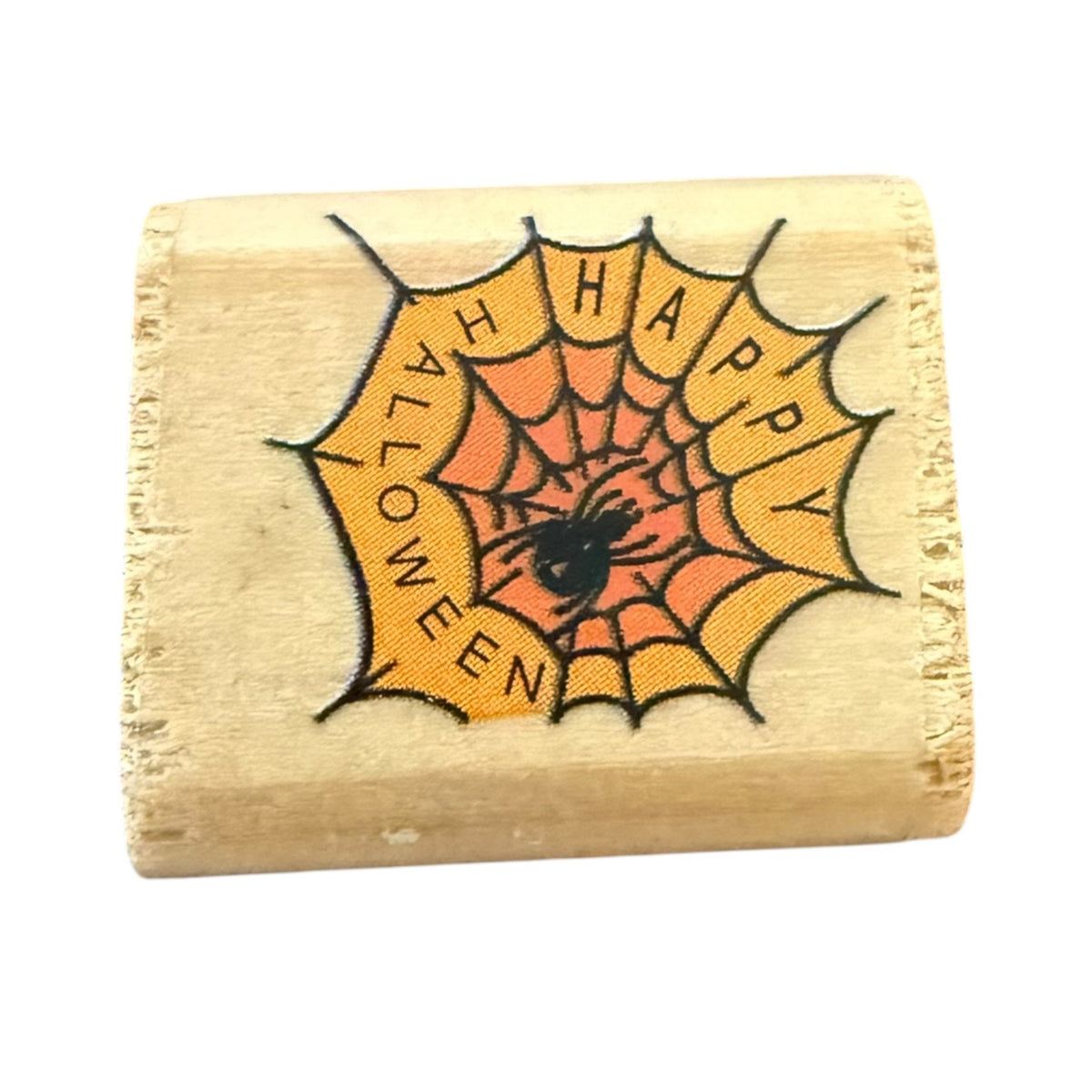 Wooden block with a Halloween design featuring a spider web and 'Happy Halloween' text.