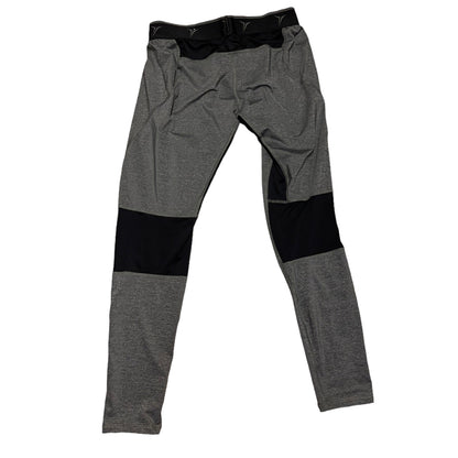 Back of Gray pants with black areas on a white background