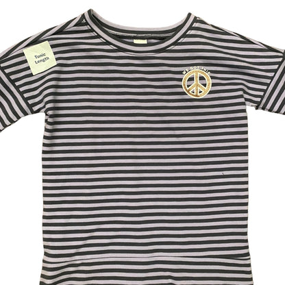 Front of purple and white striped t-shirt with a peace symbol logo on a white background