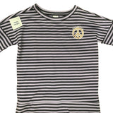 Front of purple and white striped t-shirt with a peace symbol logo on a white background