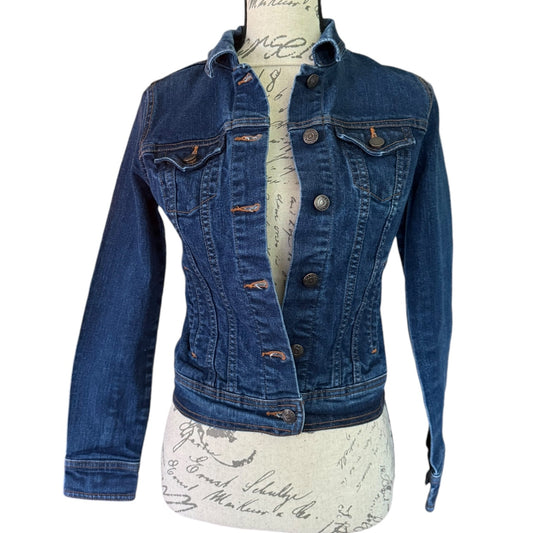 Front of Blue denim jacket on a mannequin with a white background