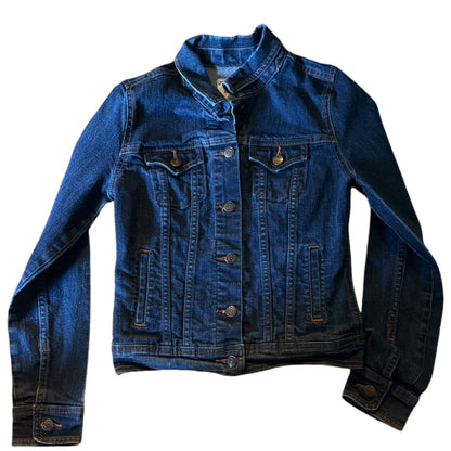 Blue denim jacket laying flat on a white background