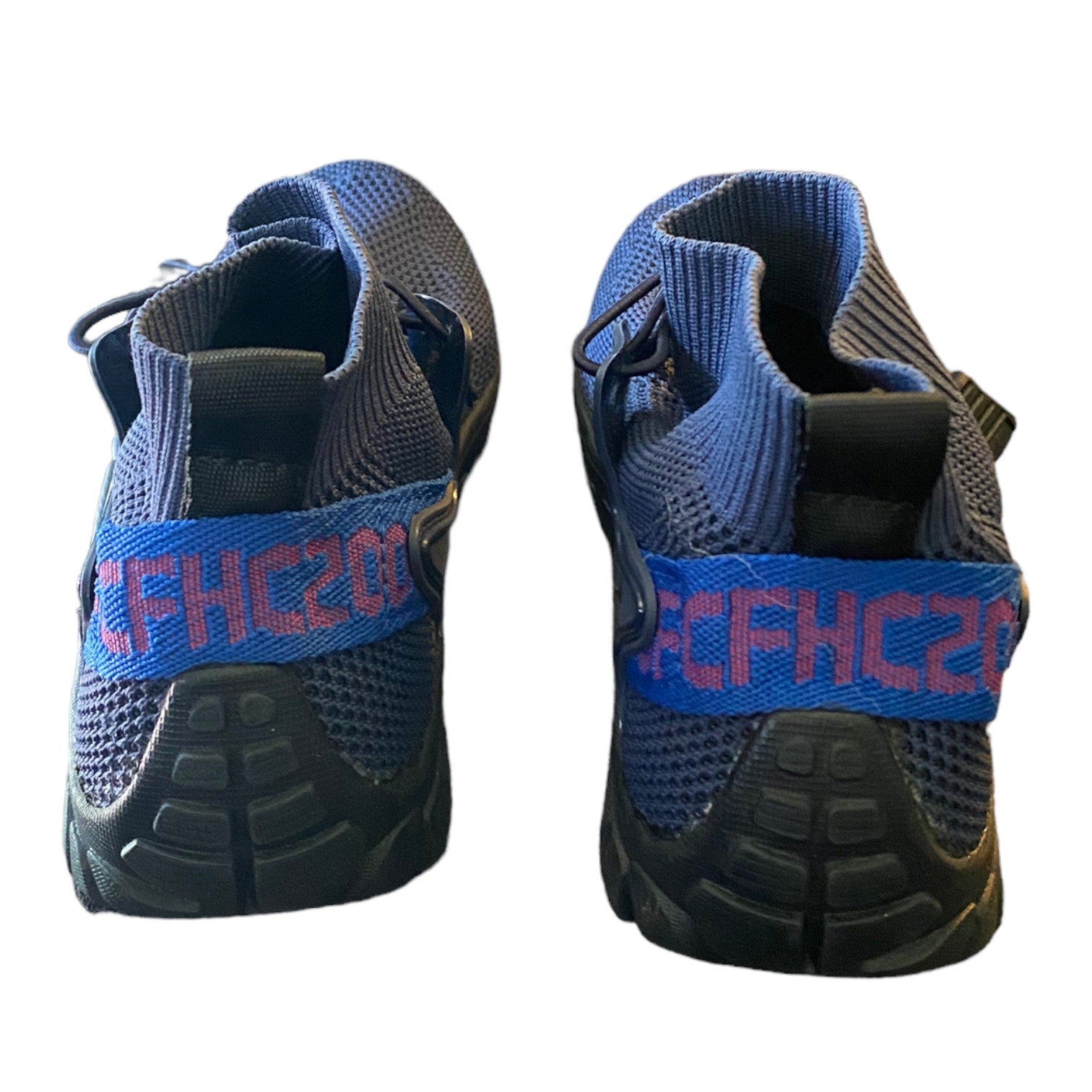 Back of Blue and black shoes with 'CFHC20' branding on a white background