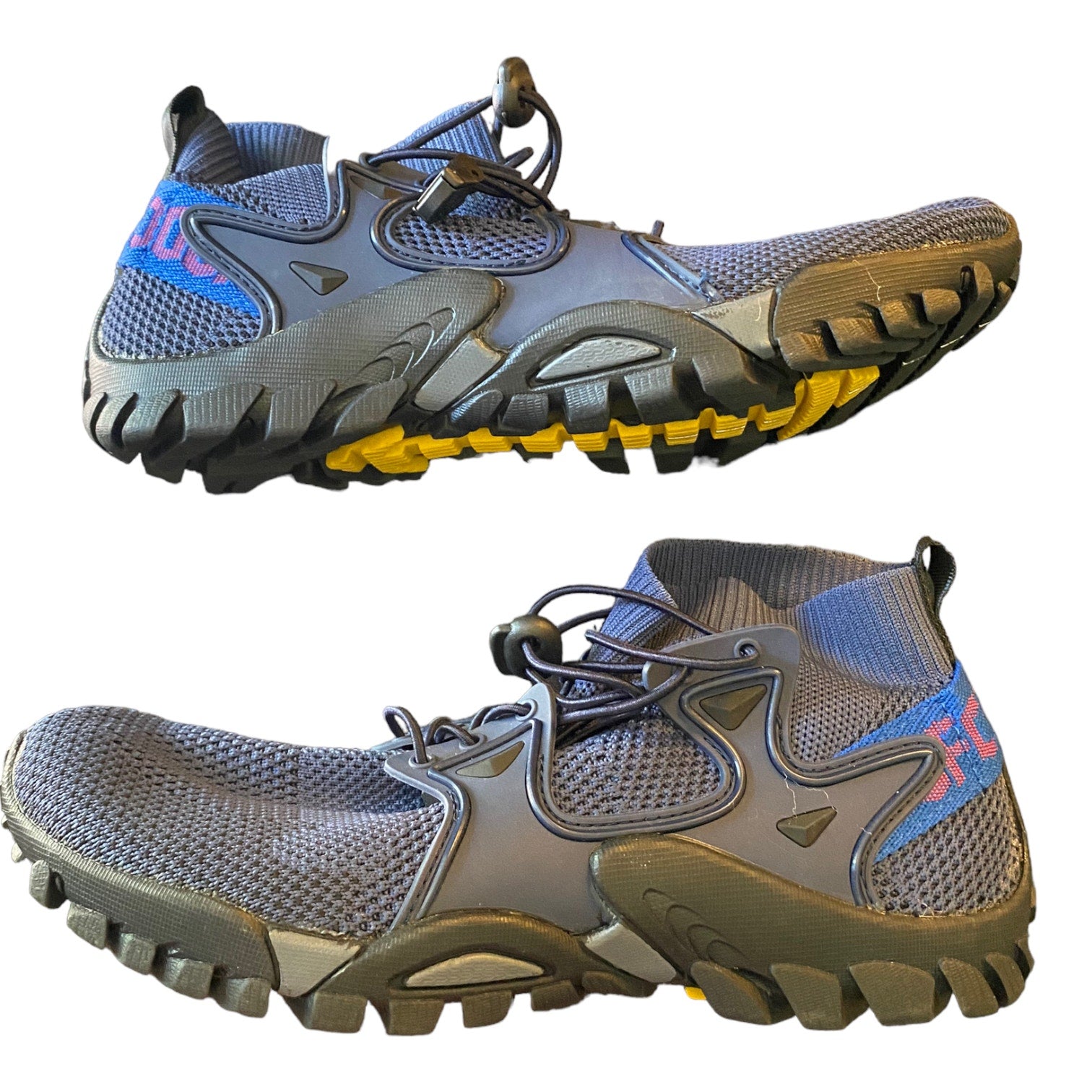 Side of blue athletic shoes with yellow sole on a white background