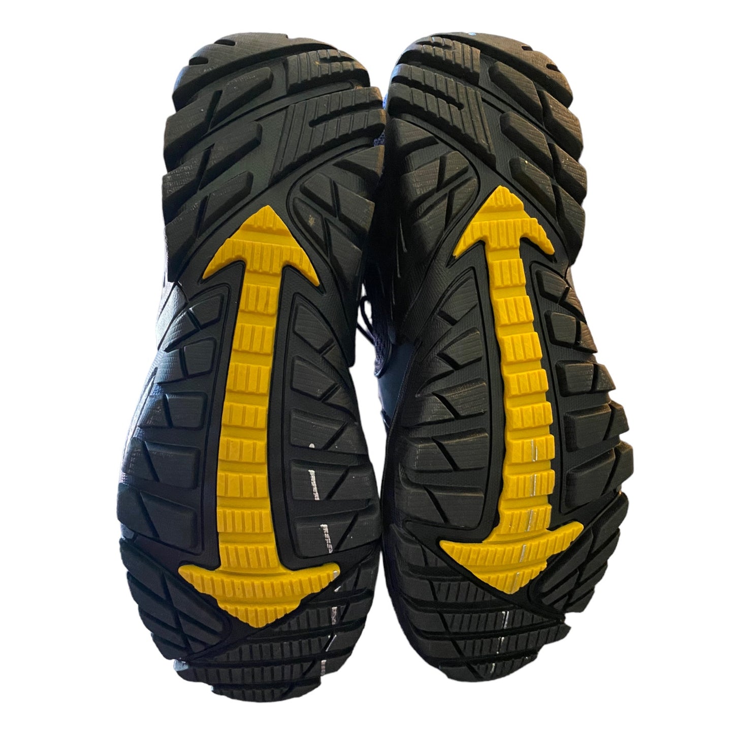 Black and yellow sole of a shoe on a white background