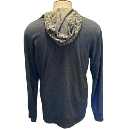 Blue hoodie with patterned hood on a mannequin against a white background